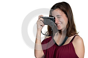 Teenage girl taking a photograph with a modern digital camera