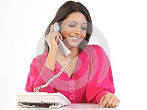 Teenage girl talking over telephone receiver