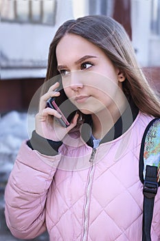 Teenage girl talking on the phone