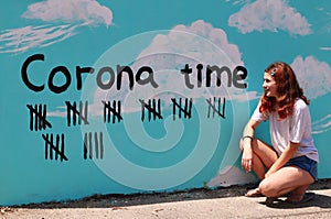 A teenage girl and a tally marks for the end of Corona`s days.