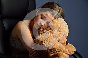 Teenage girl with a teddy bear