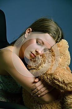 Teenage girl with a teddy bear