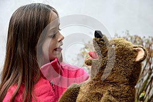 Teenage girl with teddy bear