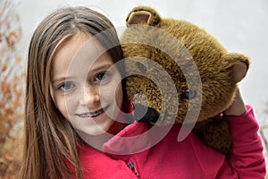 Teenage girl with teddy bear