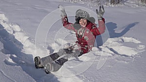 Teenage girl throws snow in winter park slow motion stock footage video