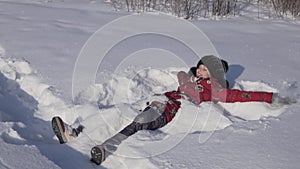 Teenage girl throws snow in winter park slow motion stock footage video