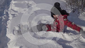 Teenage girl throws snow in winter park stock footage video