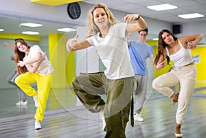 Teenage girl training breakdance Footwork moves in dance hall