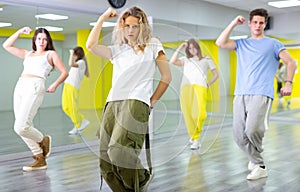 Teenage girl training breakdance Toprock moves in dance hall