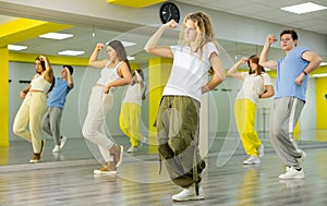 Teenage girl training breakdance Toprock moves in dance hall