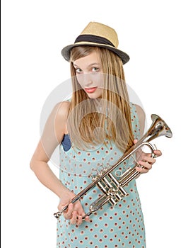 A teenage girl with a trumpet and a hat