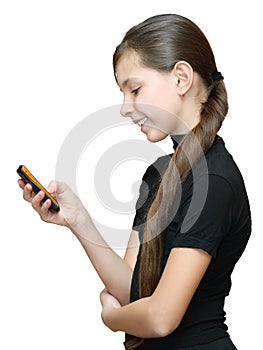 Teenage girl typing sms on the mobile phone