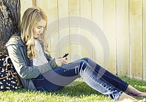 Teenage girl using a cell phone