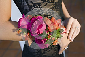 Teenage girl wearing corsage close-up of flowers