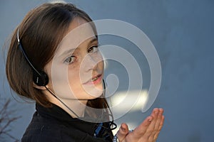 Teenage girl wearing headphones listening to music