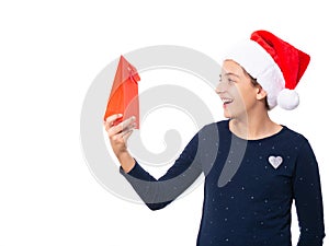 Teenage girl wearing a Santa hat and looking happy