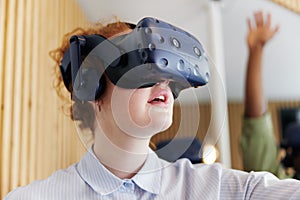 Teenage girl wearing vr goggles