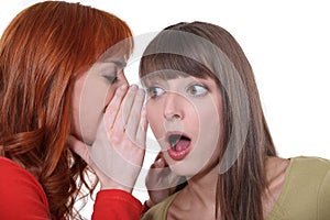Teenage girl whispering