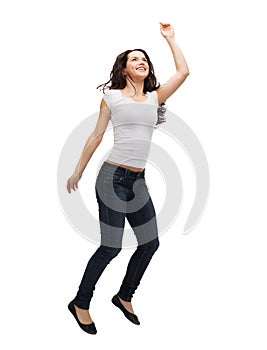 Teenage girl in white blank t-shirt jumping