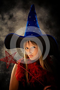 teenage girl with wizard hat and wand