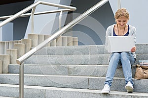 Teenage girl working on her laptop computer