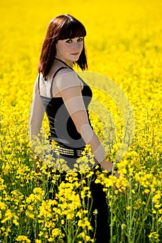 Teenage girl on yellow field