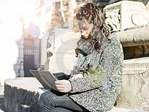 Teenage girl / young student researching on tablet