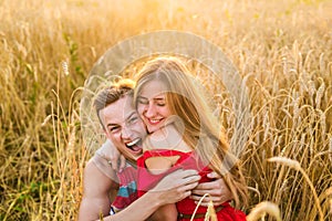 Teenage girlfriend and boyfriend having fun outdoors, kissing, hugging, love concept.
