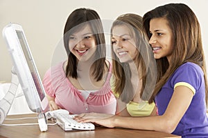 Teenage Girlfriends on Computer at Home