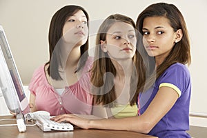 Teenage Girlfriends on Computer at Home