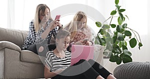 Teenage girls browsing social media content on mobile phone and smartphone