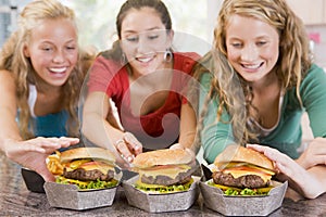 Teenage Girls Eating Burgers