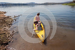 Teenage Girls Paddling Canoe