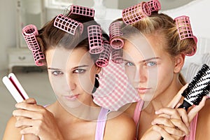 Teenage girls pulling a pose with beauty equipment