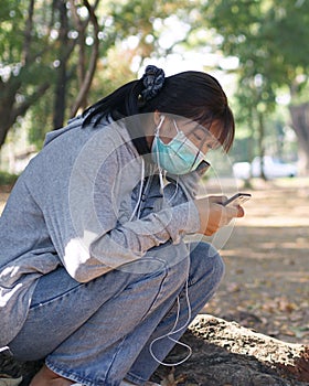 Teenage girls smiling wildly using a smartphone