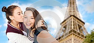 Teenage girls taking selfie over eiffel tower