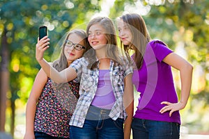 Teenage girls taking selfie