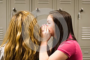 Teenage girls telling secrets photo