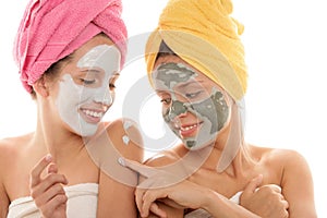 Teenage girls wearing facial mask