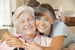 Teenage Granddaughter Visiting Grandmother At Home