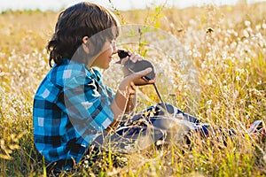 Teenage happy boy playing with rat pet outdoor