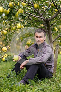 Teenage kid at apple harvest