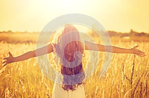 Teenage model girl in white dress enjoying nature