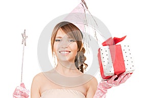 Teenage party girl with magic wand and gift box