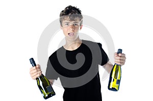 Teenage partying with two bottles of wine