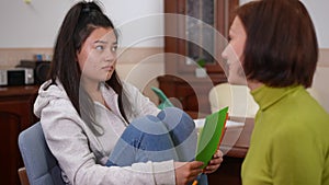Teenage patient talking with psychologist thinking telling colors associations. Portrait of Asian adolescent girl