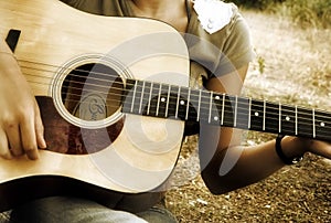 Teenage playing guitar