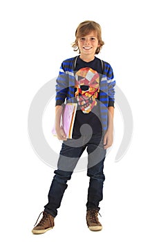 Teenage schoolboy standing with his exercise books