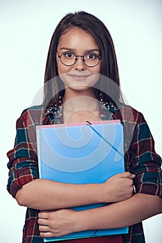 Teenage Schoolgirl in Eyeglasses Holds Books.