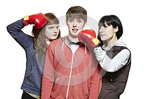 Teenage siblings fighting with boxing gloves